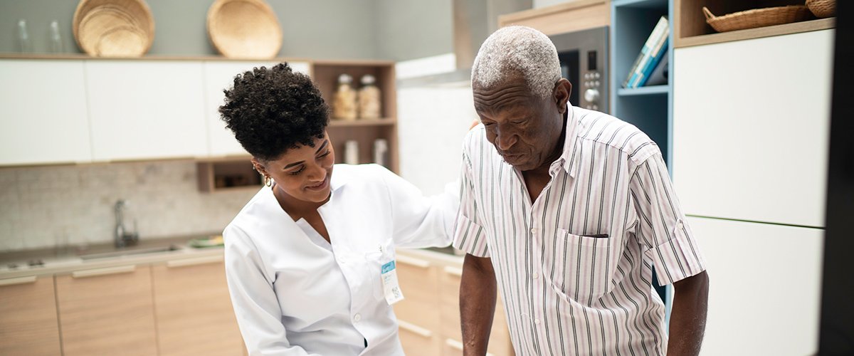 short-term-rehab-near-morrisville-ny-image-of-medical-professional-assisting-elderly-man-from-crouse-community-center